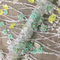 Koronkowa tkanina handwork z zielonymi koralikami